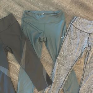 THREE PAIRS OF NIKE ATHLETIC LEGGINGS